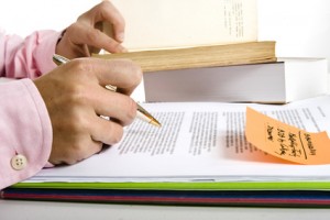 Pen and Pile of books for Study and Research